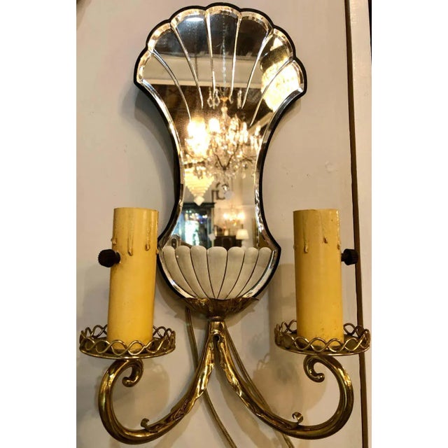 Pair of Jansen wall sconces. Hollywood Regency era with mirror backs each having two arms and etched mirror back plates.