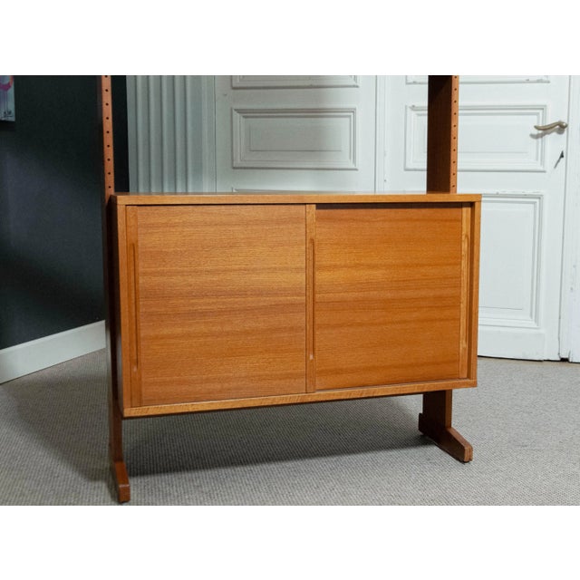 This modular teak shelving system, designed by Kajsa and Nils "Nisse" Strinning in the 1960s, is a prime example of...