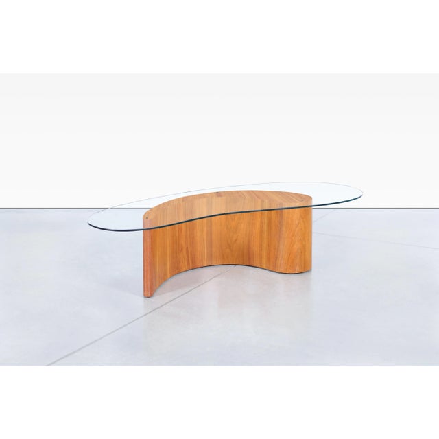 A striking example of mid-century modern design, this mid-century coffee table captures the sculptural spirit that made...