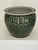 The Planter: A beautiful, deeply glazed ceramic fishbowl featuring an intricate, repeating medallion motif in a rich,...