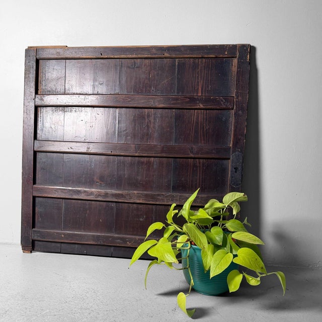 This antique Japanese door panel originally formed part of a piece of furniture and stands out for its restrained, serene...