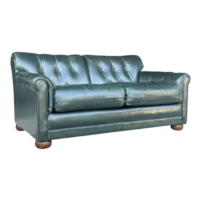 This sophisticated vintage leather sofa beautifully blends classic English styling with relaxed contemporary comfort....