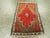 This Mid-20th century Turkish Anatolian rug, measuring 1' 2" x 1' 11", is a small yet striking example of the bold...