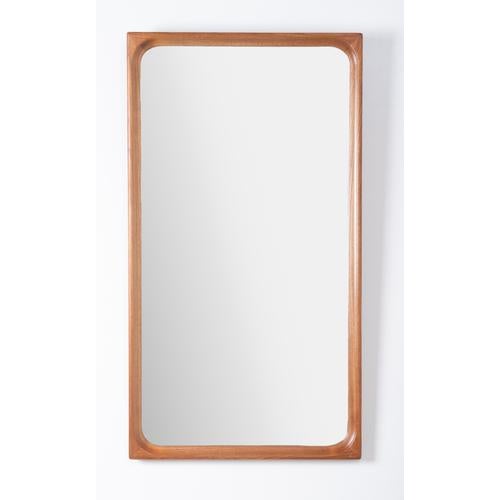 Elegant wall mirror produced in Denmark during the 1960s. Featuring a beautifully shaped solid teak frame, this piece...