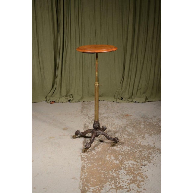 An unusual and versatile Victorian occasional table, likely by John Carter, having a circular burr walnut veneered top on...