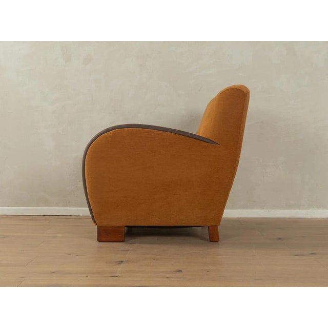 A wonderful Art Deco armchair from the 1930s. High-quality solid wood frame. The original spring core has been...