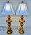 Pair of Monumental 1920s Italian Carved Giltwood Pineapple Table Lamps - 36" Tall Hollywood Regency A spectacular pair of...