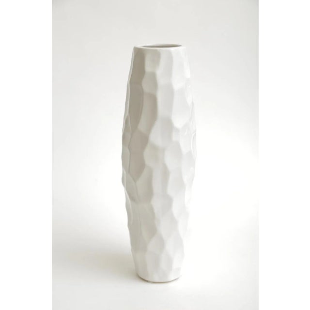 This tall Italian vintage textural white ceramic vase or vessel has sculptural presence to it. It is from the 80's. It has...