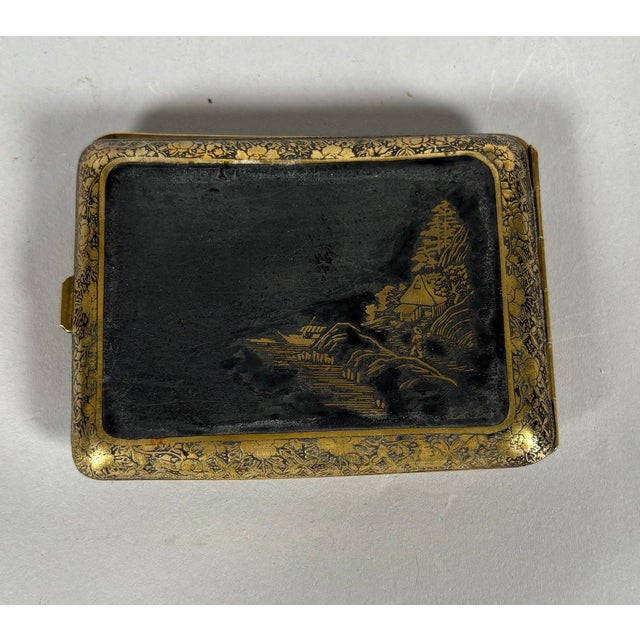 Japanese cigarette case, Meiji Fuji era, early 20th century. The case is made of lacquered steel inlaid with gold. One...
