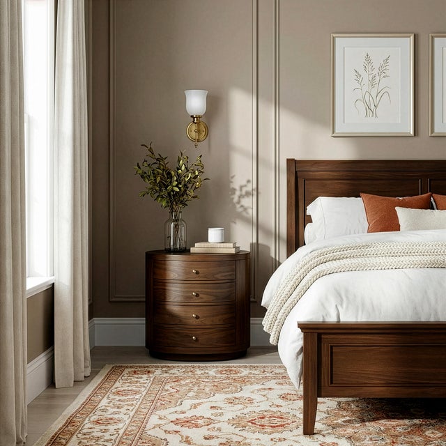 Elevate your bedroom with the refined simplicity of the Butler Specialty Company Nora Oval Nightstand, where soft curves...