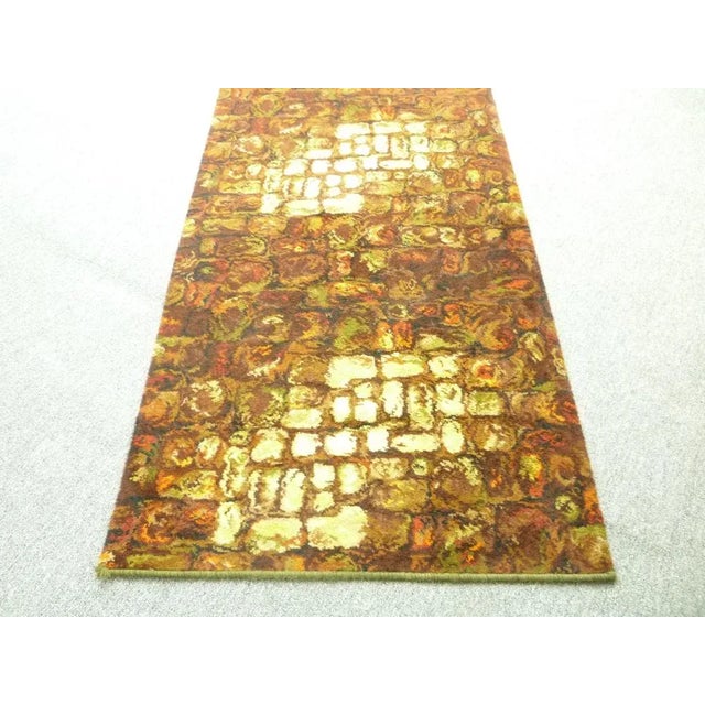 Colorful and very long flower power carpet from the 70s. The carpet is from the first owner and comes from a holiday home....