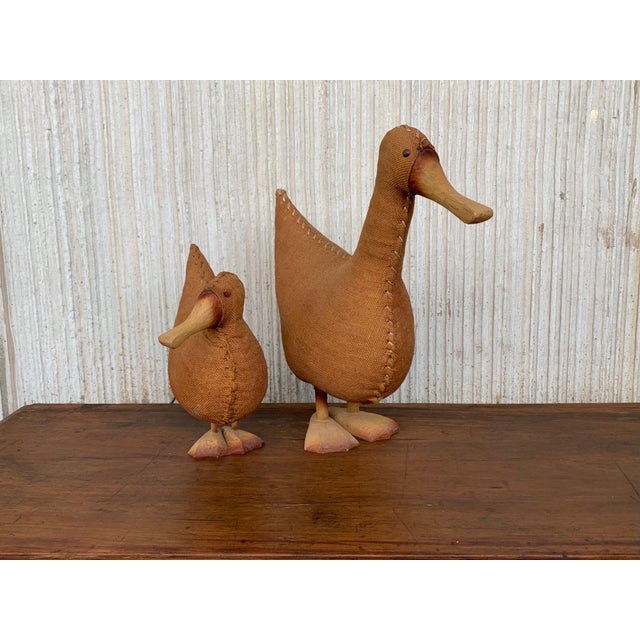 Wicker duck from with an intricate woven wicker structure and highlighted with wood wings and a sculpted bill and feet.