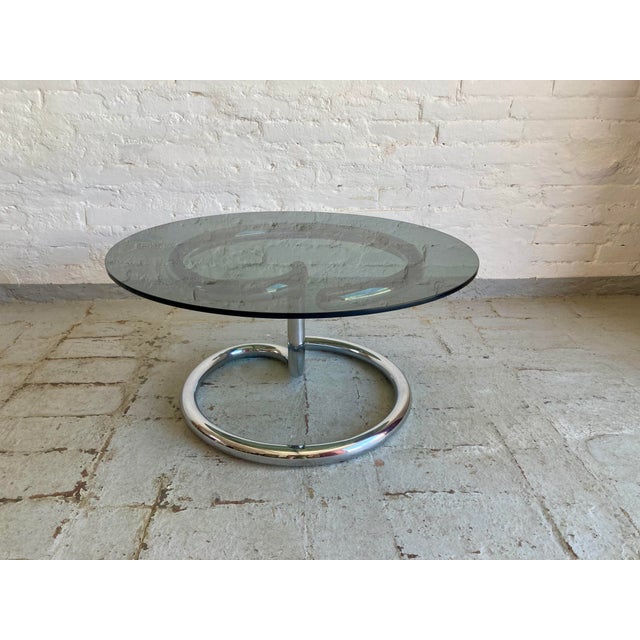 Chrome plating in excellent condition. Glass perfectly preserved, no chips, chips, or scratches. This piece is attributed...