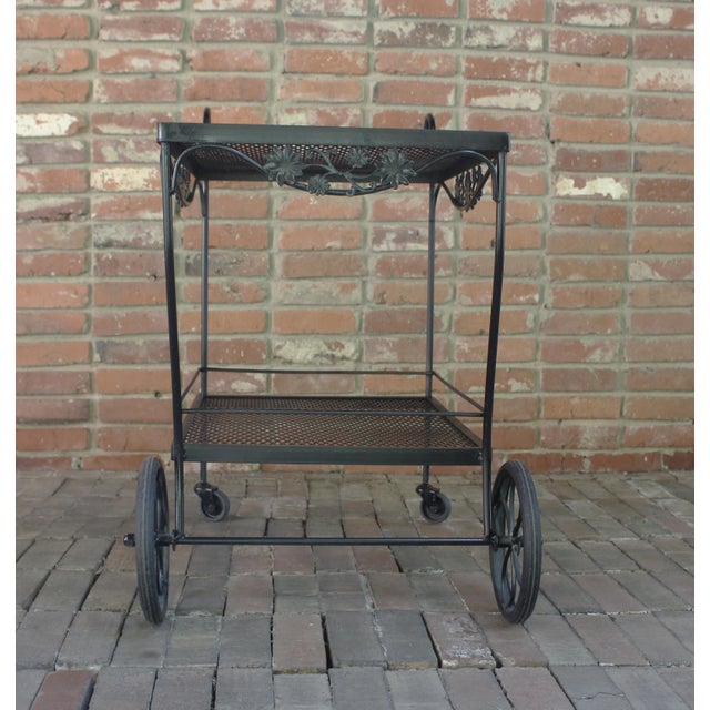 Circa 1980s wrought iron bar cart by Russell Woodard. The "Arnold Palmer" collection, created in 1978. Woven surfaces,...
