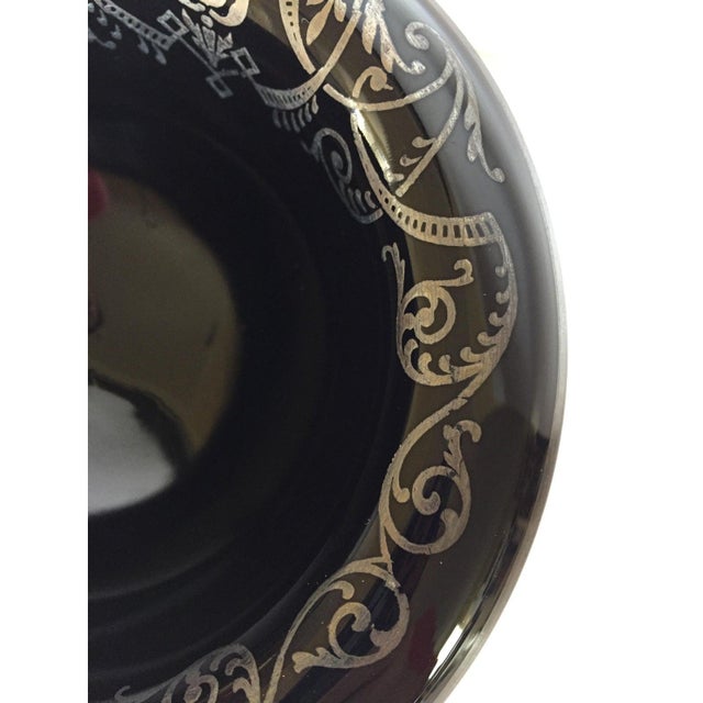 This pedestal bowl is a favorite piece from my collection! Opaque glossy black glass is made in the perfect shape! The...