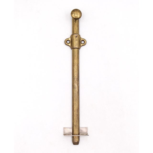 Vintage surface mount slide door bolt made of steel with a brass finish. The catch is made of brass with a nickel finish....