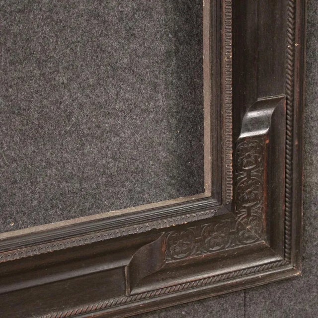 French frame from the second half of the 20th century. Guillauché furniture in carved and ebonized wood, of beautiful...