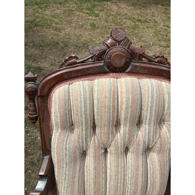 Beautiful antique Eastlake chair. Has metal casters, and is very comfortable to sit in. Fabric is as found in excellent...