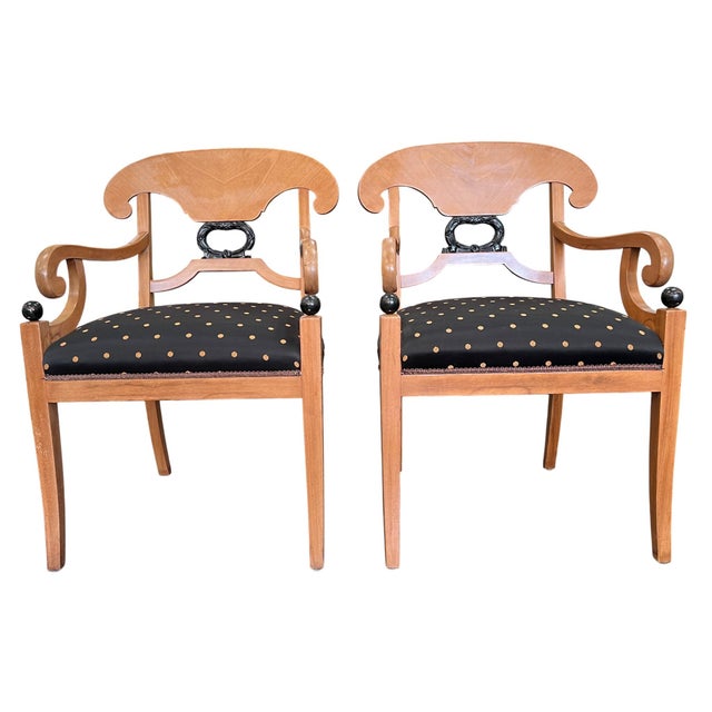 This pair of Biedermeier-style Empire armchairs blends the architectural aesthetic of Neoclassicism with the decorative...