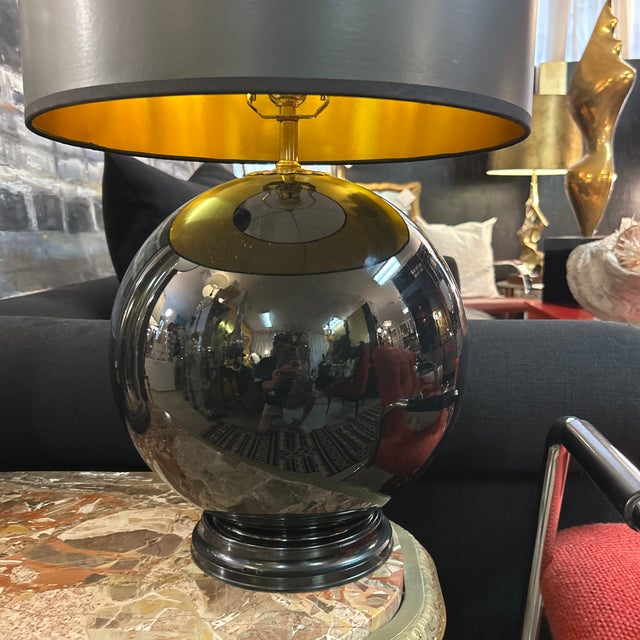 Round black ceramic table lamp. Custom black shade is included. For a higher output of light a white or lighter color...