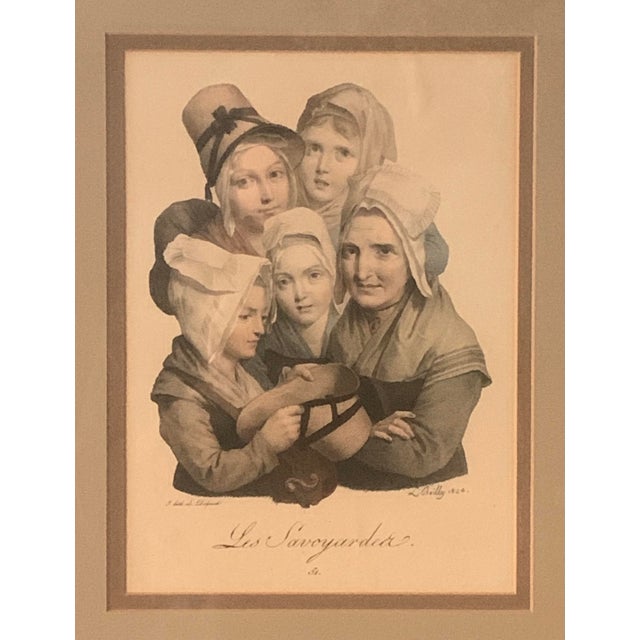 This mid-19th century lithograph features a caricature of the women of the French region of Savoy (Savoie) – les...