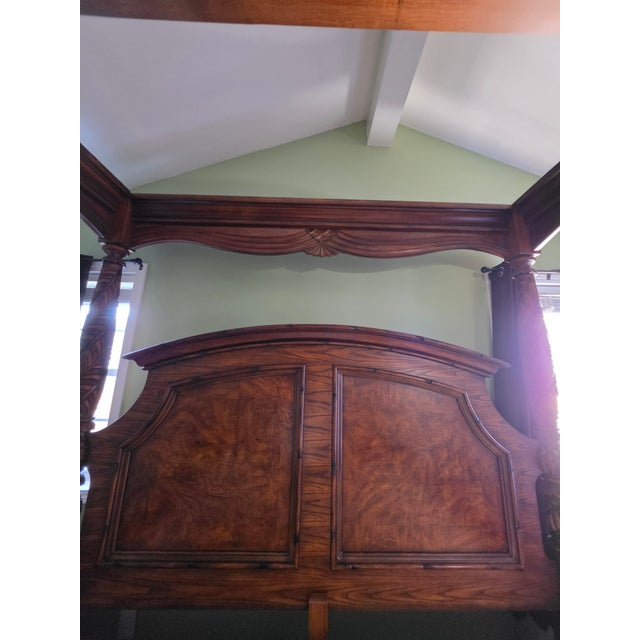 This is a burled oak veneer and solid wood with mahogany stain king size canopy bed from the American Signature West...