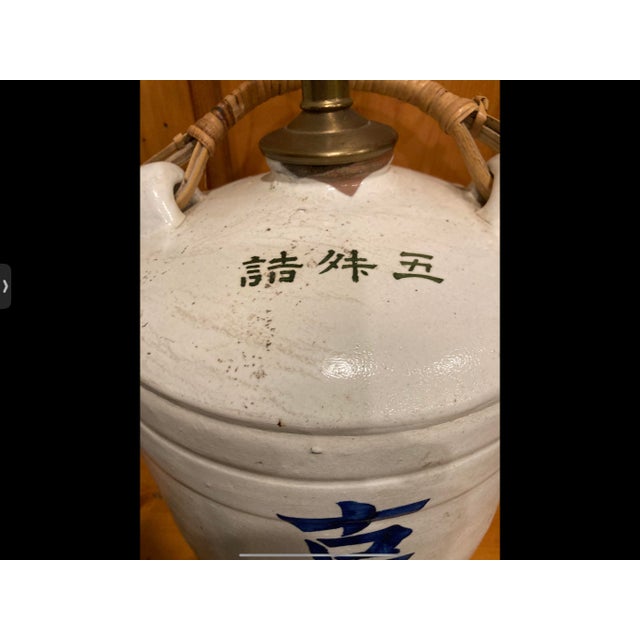 Striking vintage table lamp crafted from an authentic Japanese ceramic sake/storage jug, later professionally converted...