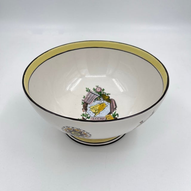 A footed pedestal porcelain bowl features maps and rivers of France, including the Moselle, Rhone, and Ardennes around the...