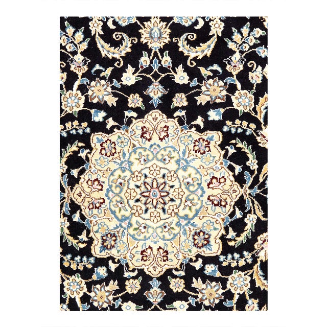 Nain rugs are renowned for their detail and fine use of outlining along the central motifs. Breaking from the classical...