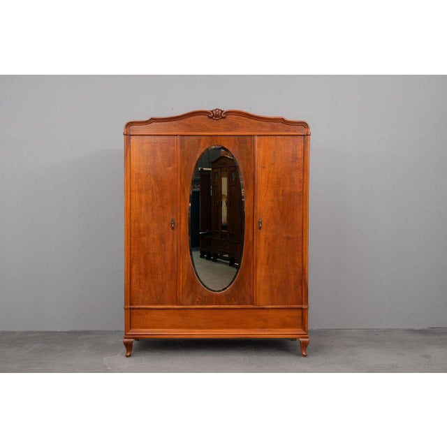 Item: Three-door wardrobe Period & Style: Art Nouveau - Early 20th century Features: - Decorative and functional piece of...