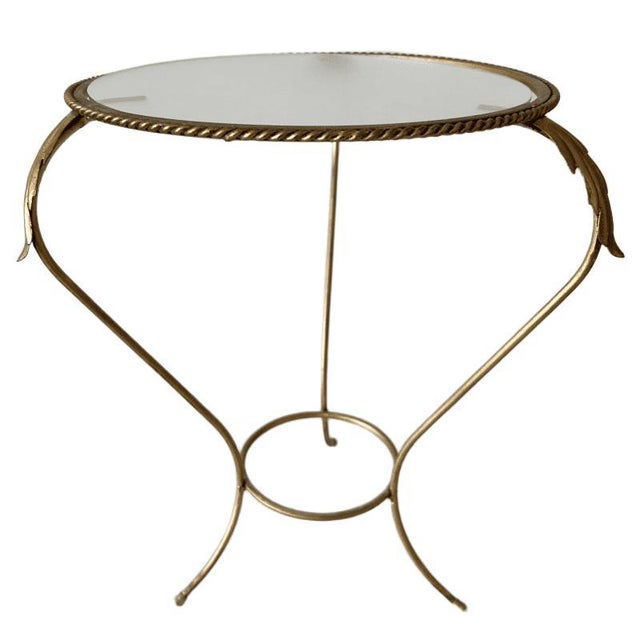 Beautiful vintage mid-century gold wrought iron plant table from the 1960s with acanthus leaf accents. The wrought iron...