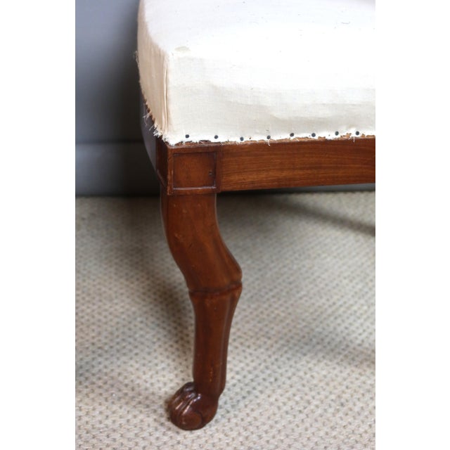 Set of six Empire period carved wooden chairs. The front legs feature a characteristic hock-shaped design of the period,...