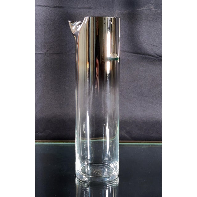 This cylindrical cocktail pitcher features the silver ombre fade decoration closely associated with Dorothy Thorpe, where...