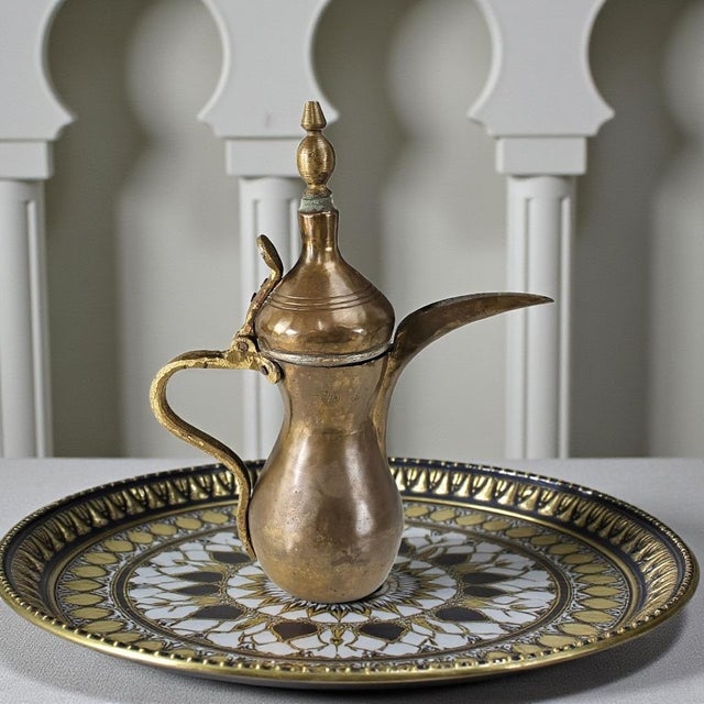 This antique Arabic dallah coffee pot dates to the 19th century and originates from the Middle East, likely the Arabian...