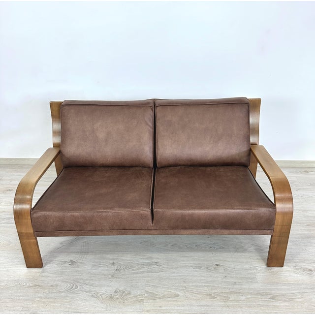 Dimensions: H 31” x W 57.7” x D 31” x SH 16.5”. Vintage German two-seater sofa designed by Walter Knoll, newly upholstered...
