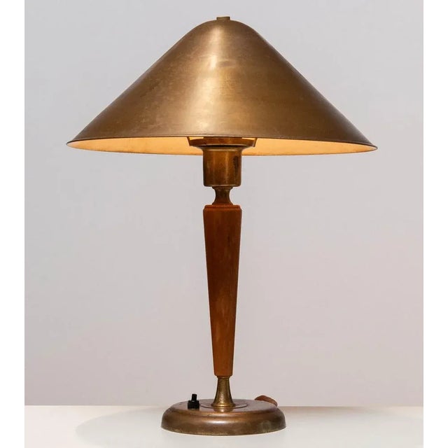 Brass and elm modernist table / desk lamp with beautiful patina true the years by Harald Norton for Böhlmarks in Sweden...