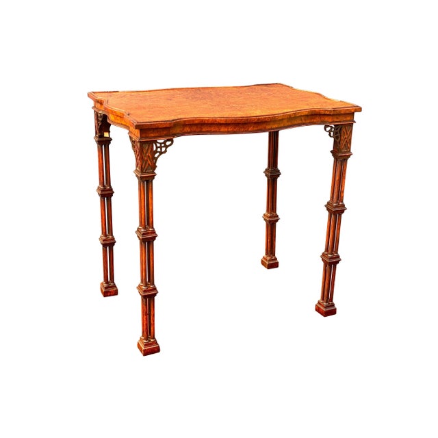 Finely made with a wonderful burl veneer top of serpentine shape raised on cluster column legs headed by blind fretwork...