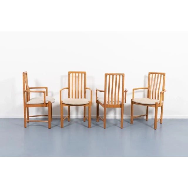 Set of four armchairs designed by Hans J. Frydendal and produced by Boltinge Stolefabrik. Solid oak frame with sand fabric...