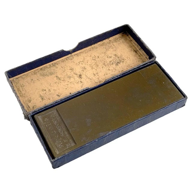 An E.E. Monson Co. Ahconite Razor Hone, sharpening stone.