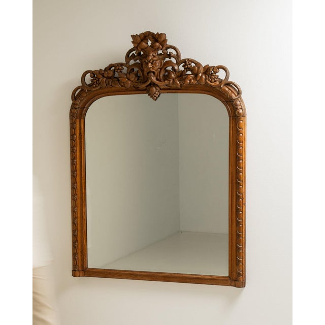 This piece presents as a cabinet, distinguished by medium honey oak, carved scroll. Originating in France during 19th...