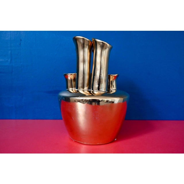 Sculptural and luminous, this contemporary vase is unlike any other and immediately catches the eye. Five slightly flared...