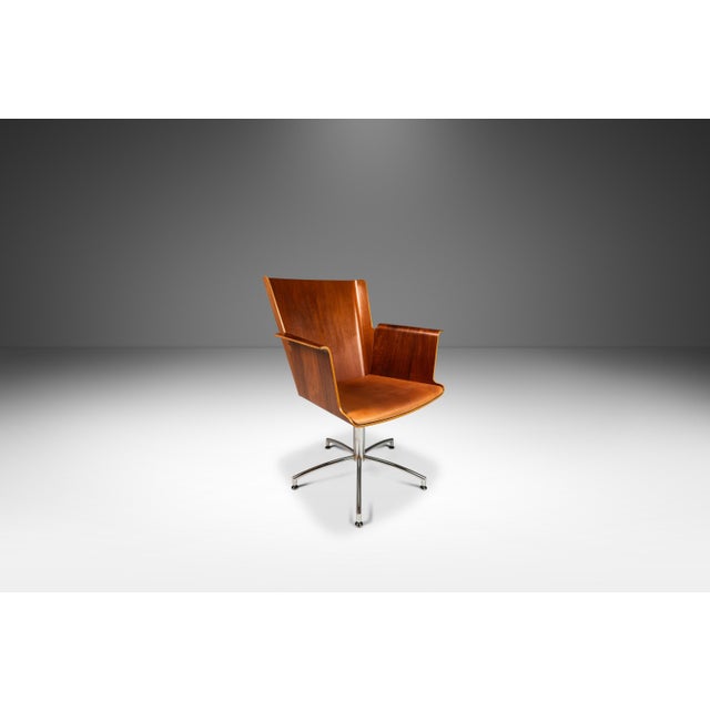 Discover the epitome of Scandinavian design with the Vinga Swivel Chair, a masterful creation by renowned designer Åke...