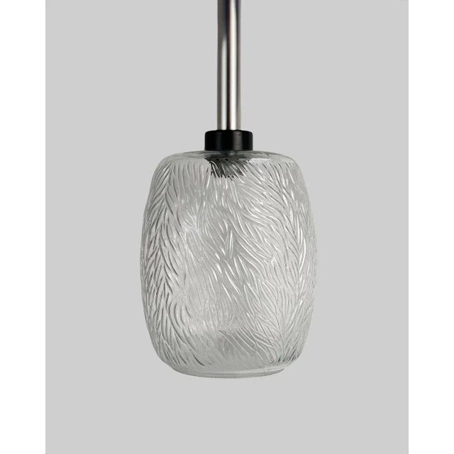 - Pair of stylish German vintage chandeliers - Made of structured, embossed glass. Chrome plating - Circa 1970s. Up to...