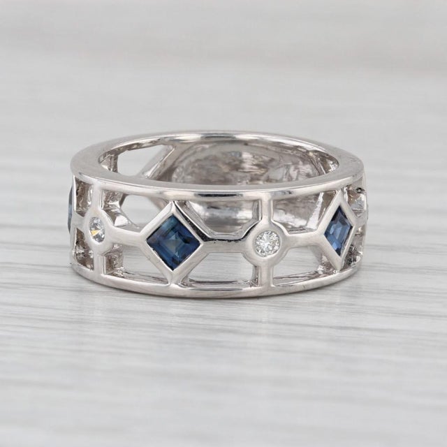 Gemstone Information: - Natural Sapphires - Total Carats - 0.60ctw Cut - Square Color - Dark Blue Treatment - Heated -...