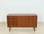 For sale is this exquisite vintage sideboard in the timeless mid-century style of the 1960s. It impresses with its elegant...