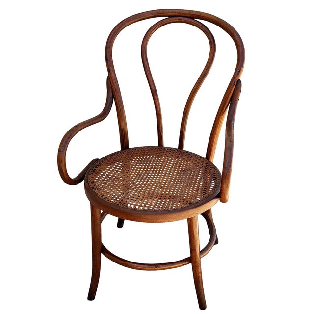 Victorian bent oak & cane number 18 oak armchair by Jacob & Josef Kohn for Thonet features an elegant, sculptural frame...
