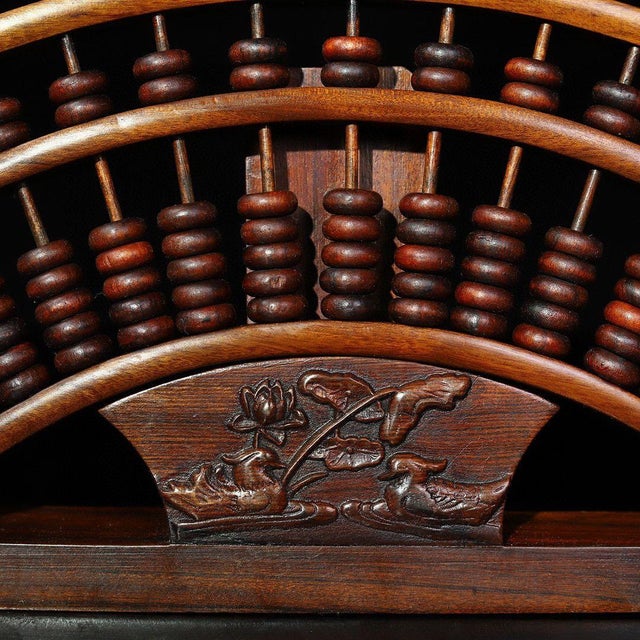 This beautifully crafted abacus is a striking example of traditional Chinese design. Unlike a standard rectangular abacus,...