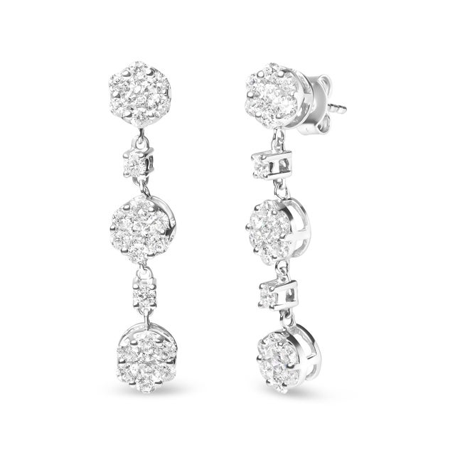 Indulge in the beauty of nature with these stunning 14K white gold floral drop earrings. Each earring features a...