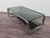 Vintage coffee table with a chromed tubular frame and double smoked glass shelves, very popular in Italian design of the...