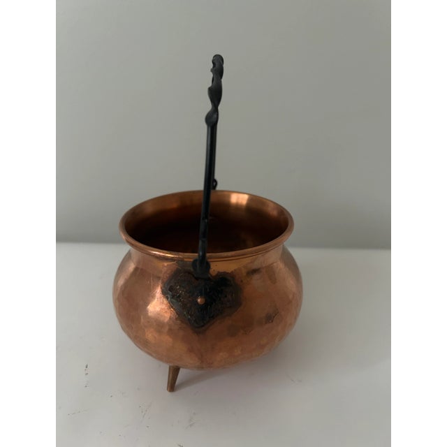 Small vintage copper cauldron with cast iron handle. Great vintage condition.
